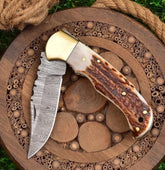 TwistHorn Damascus Folding Knife with Stag Handle & Sheath