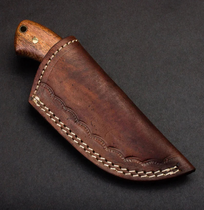 Brown leather knife sheath with wooden handle on a dark background