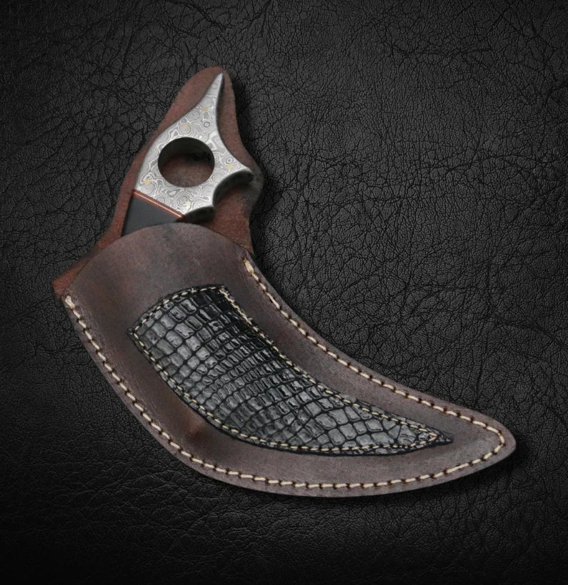 Decorative knife with leather sheath on a textured dark background