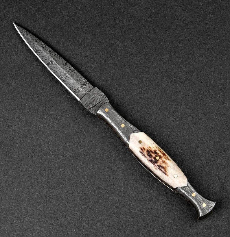 Decorative knife with a detailed handle on a dark background