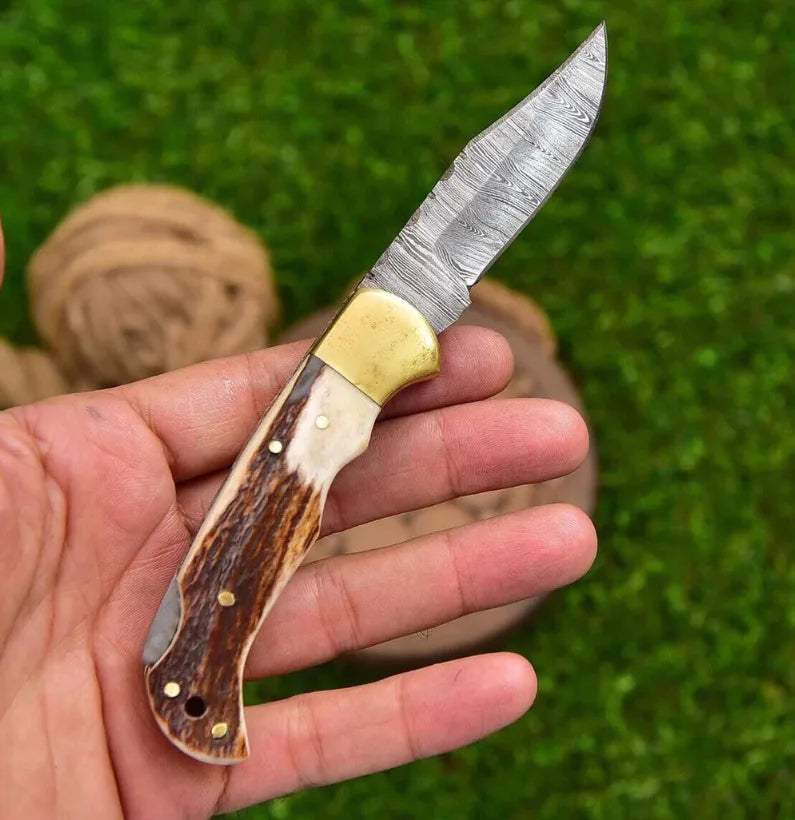 TwistHorn Damascus Folding Knife with Stag Handle & Sheath